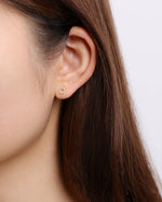 Model wearing circular cubic zirconia earring from Minimalist Touch Earrings Set in 925 sterling silver.