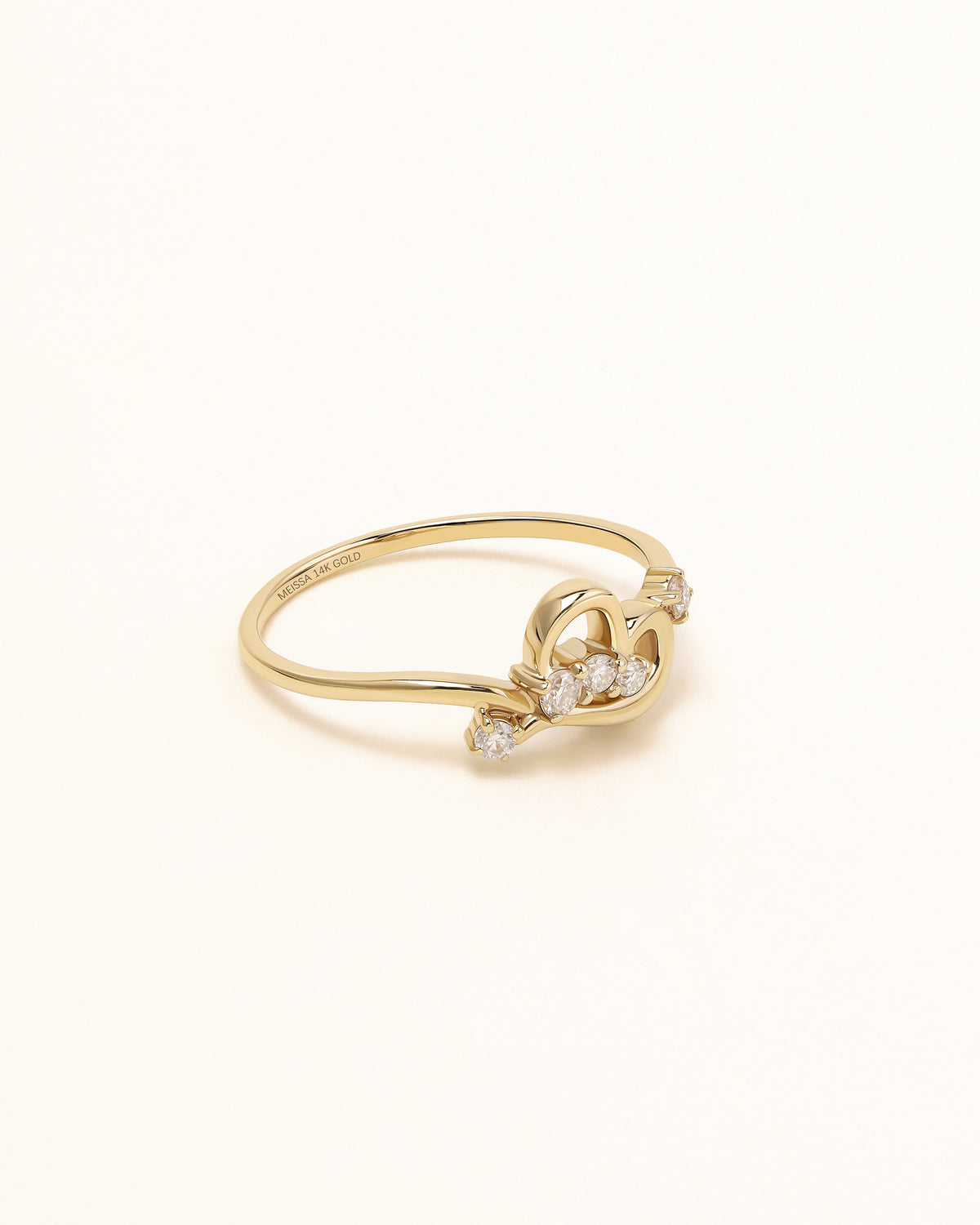 Side view of Luminous Heart Ring in solid gold showing the sculpted heart design and moissanite accents.