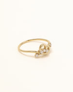 Side view of Luminous Heart Ring in solid gold showing the sculpted heart design and moissanite accents.