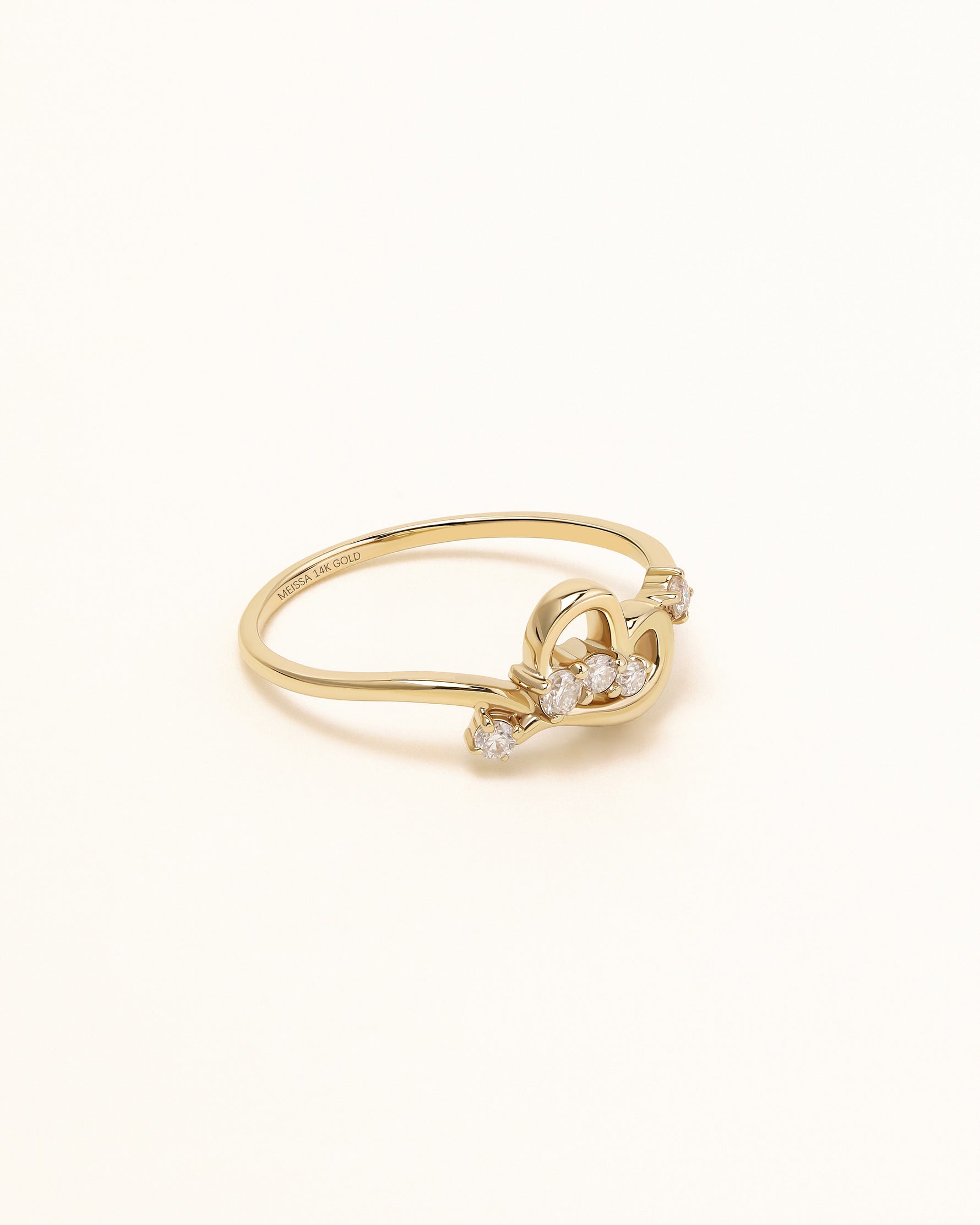 Side view of Luminous Heart Ring in solid gold showing the sculpted heart design and moissanite accents.