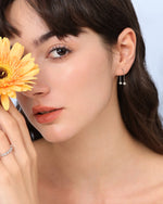 Model wearing long chain earring from Chain Chic Earrings Set in 925 sterling silver.