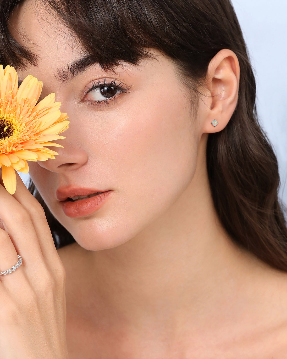 Model wearing opal earring from Spring Meadow Earrings Set in 925 sterling silver.