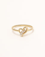 Front view of Waves of Love Ring in solid gold with three round moissanite stones.