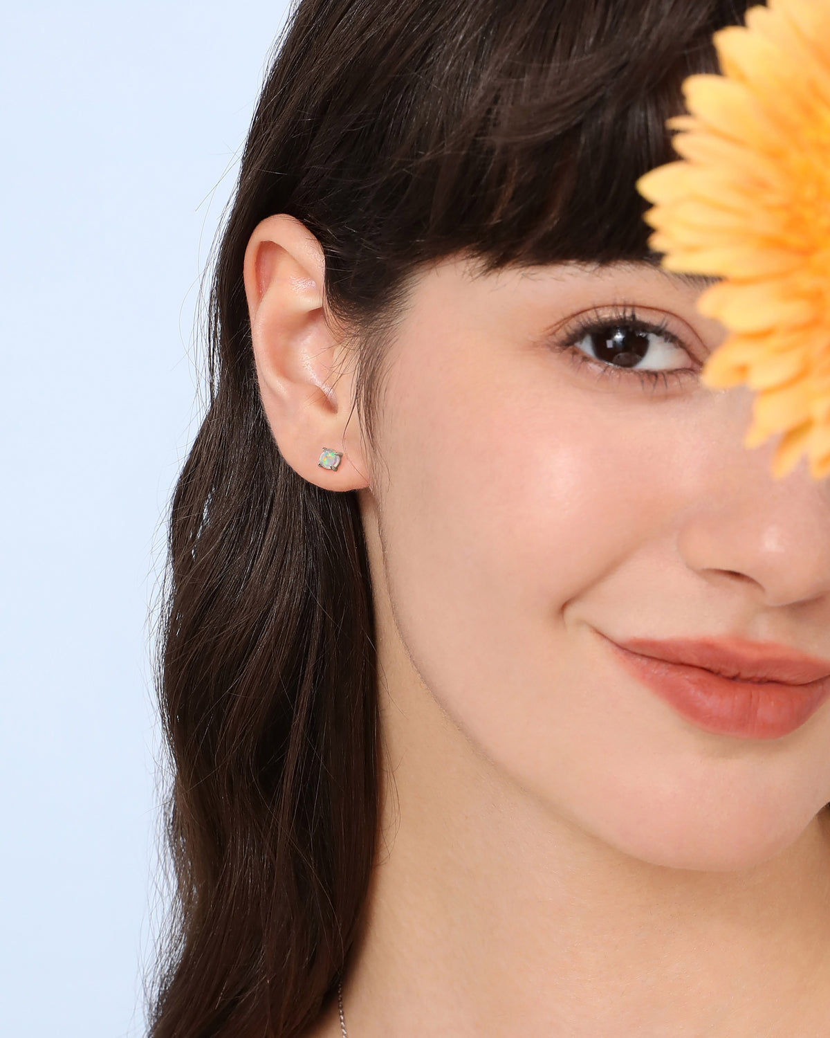 Model wearing opal earring from Spring Meadow Earrings Set in 925 sterling silver