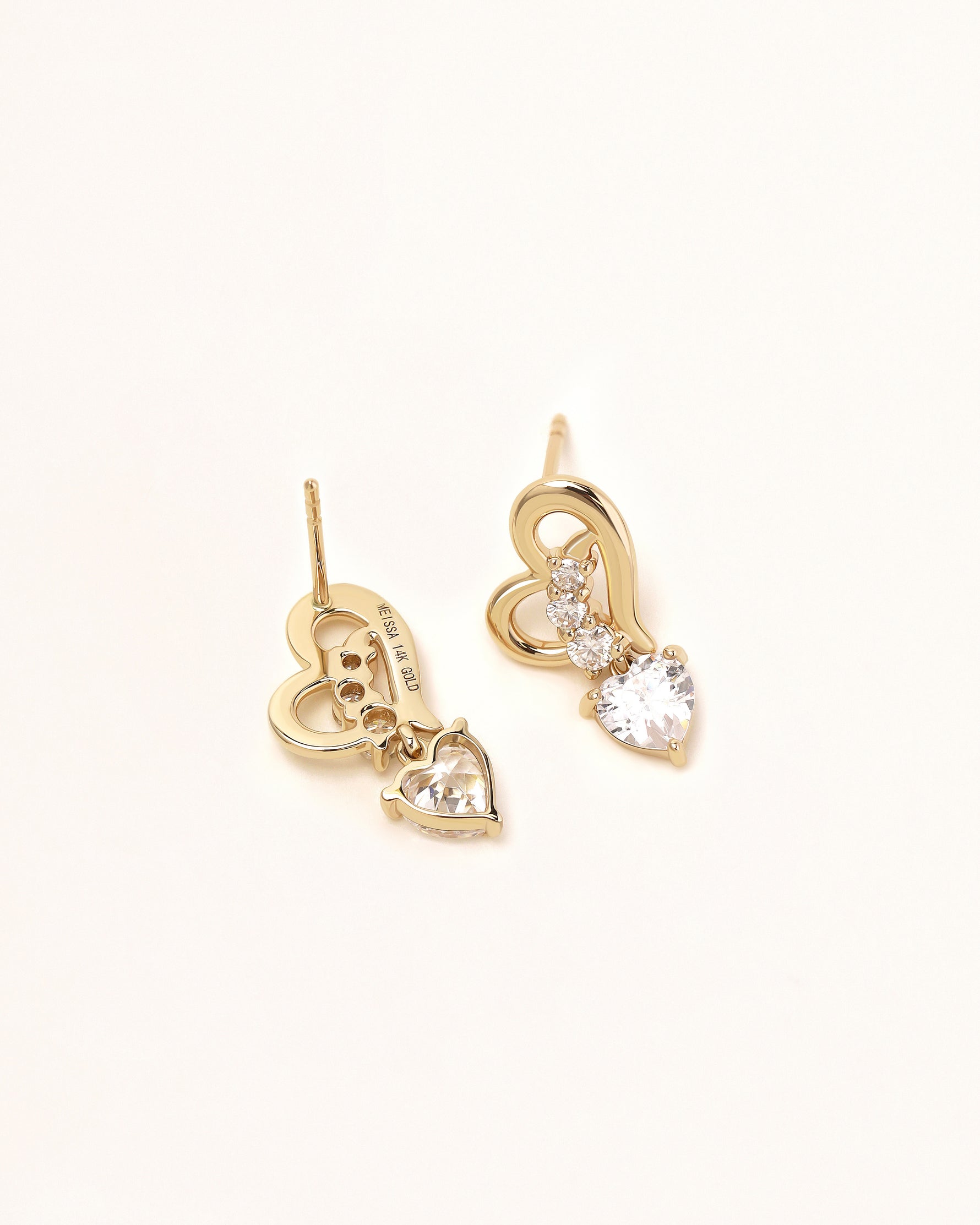 Back view of Heart of Freedom Dangle Earrings in solid gold showing the heart-shaped moissanite drops and 14K gold detail.