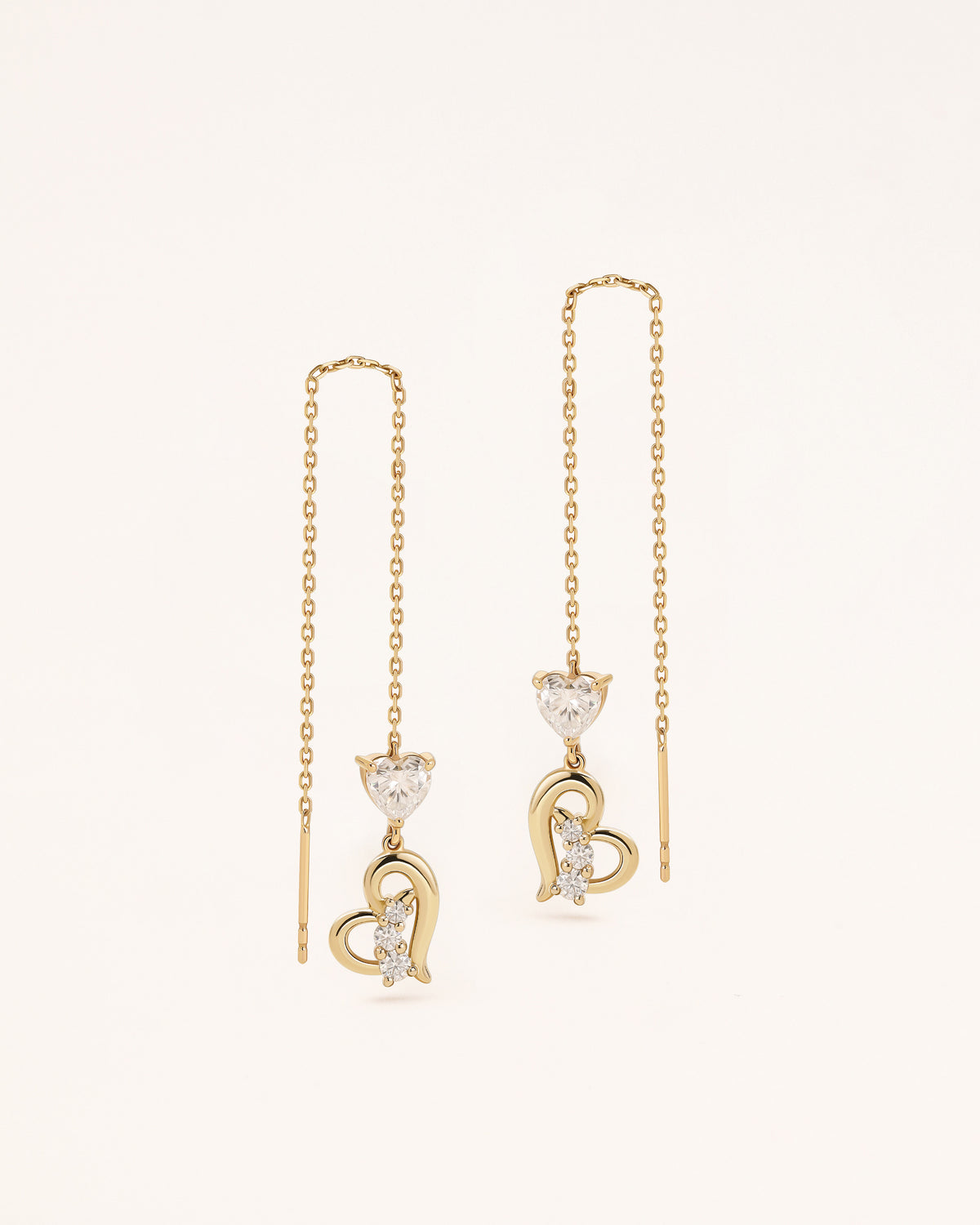 Front view of Heart of Freedom Threader Earrings in solid gold with long chain threader design and heart details.