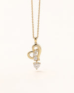 Front view of Dancing Heart Necklace in solid gold with open heart design and moissanite stones.