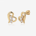 Heart of Freedom Stud Earrings in solid gold with open heart design and three moissanite stones.