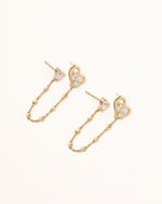 Pair of Heart of Freedom Chain Earrings in solid gold with heart-shaped moissanite and open heart charms connected by fine chains.