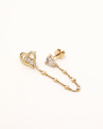 Side view of Heart of Freedom Chain Earrings in solid gold showing heart-shaped moissanite studs and decorative heart chain links.