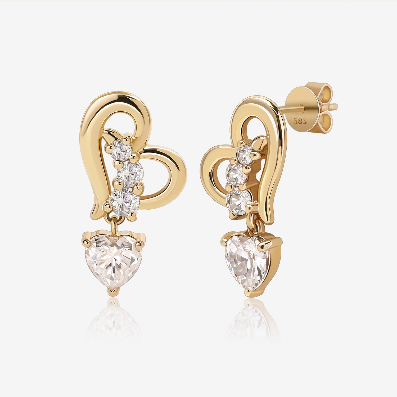 Heart of Freedom Dangle Earrings in solid gold with open heart design and heart-shaped moissanite drops.