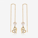 Heart of Freedom Threader Earrings in solid gold with heart-shaped moissanite and open heart charms.