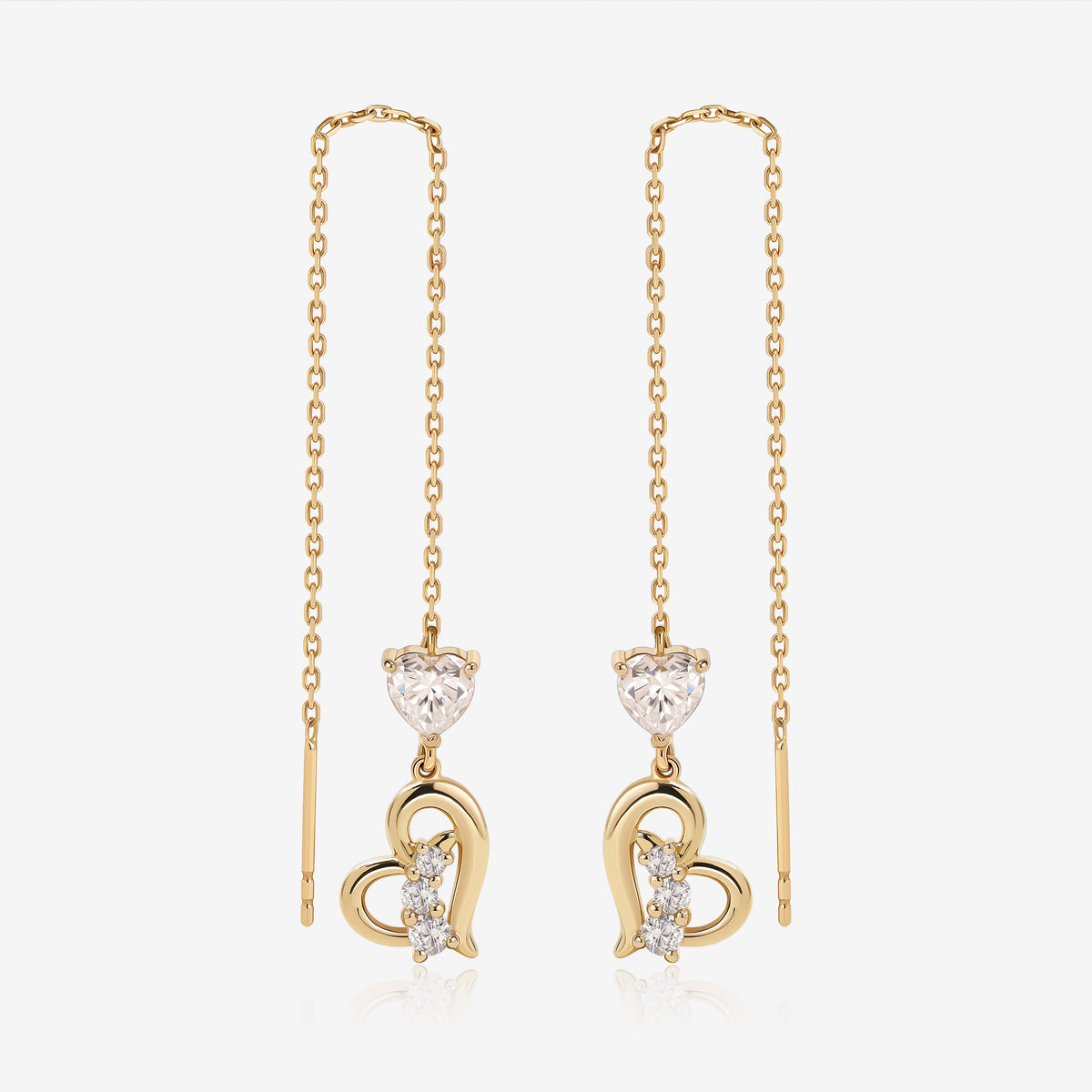 Heart of Freedom Threader Earrings in solid gold with heart-shaped moissanite and open heart charms.