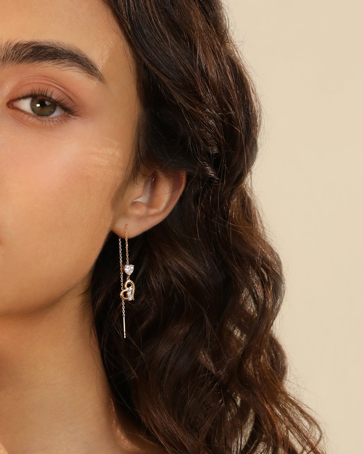 Heart of Freedom threader earring in solid gold with heart motif and heart-shaped moissanite drop.