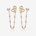 Heart of Freedom Chain Earrings in solid gold with heart-shaped moissanite studs, open heart charms, and delicate chain details.