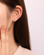 Model wearing flower earring from Spring Meadow Earrings Set in 925 sterling silver.
