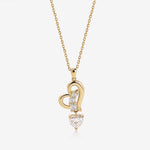 Dancing Heart Necklace in solid gold with heart-shaped moissanite pendant.