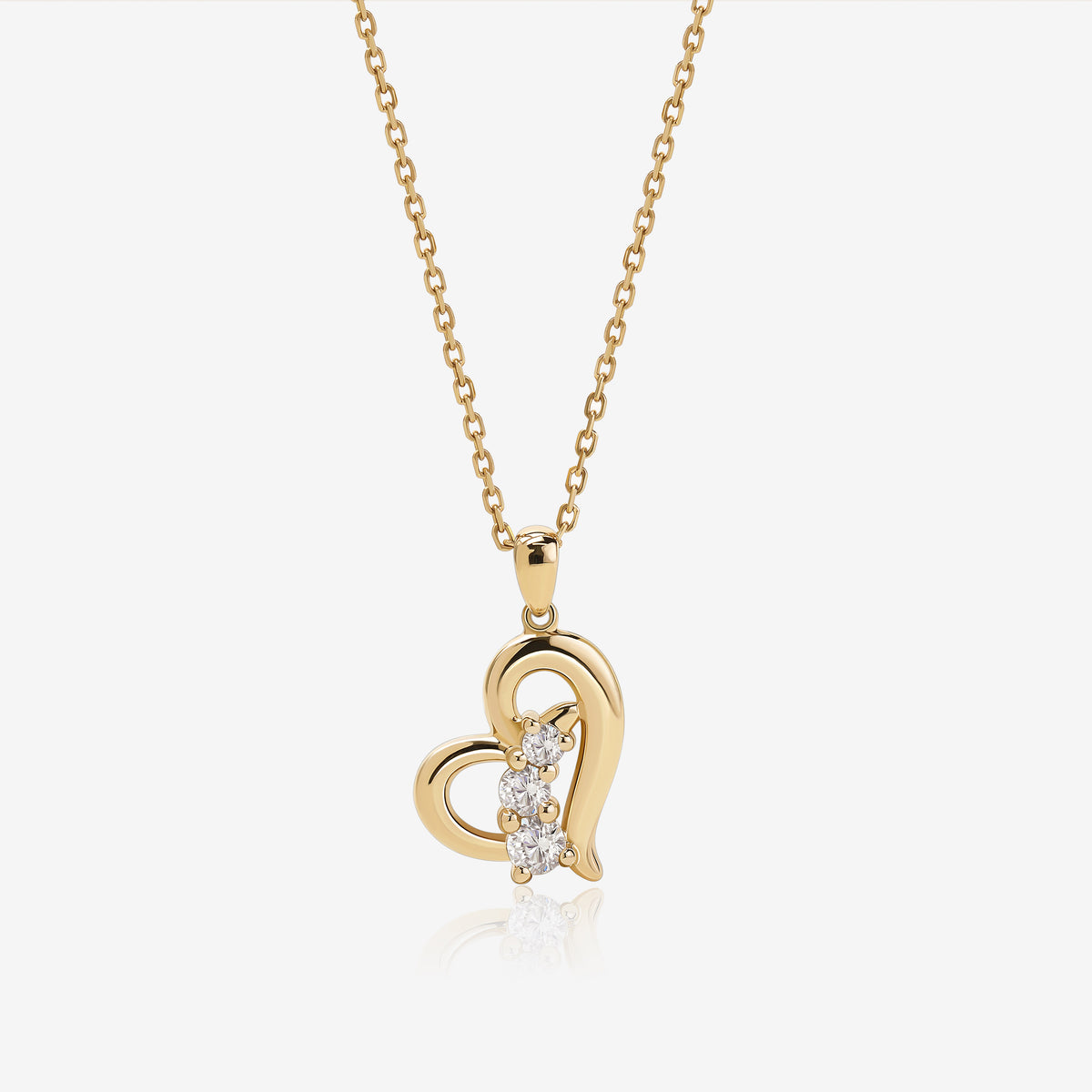 Meissa Heart of Freedom Necklace in solid gold featuring an open heart pendant accented with three round moissanite stones.