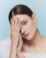 Model wearing leaf earring from Spring Meadow Earrings Set in 925 sterling silver with cubic zirconia.