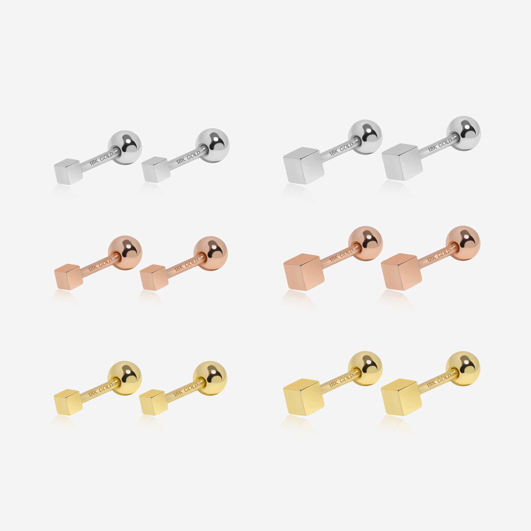 Set of gold, rose gold, and silver bar-shaped earrings on a white background