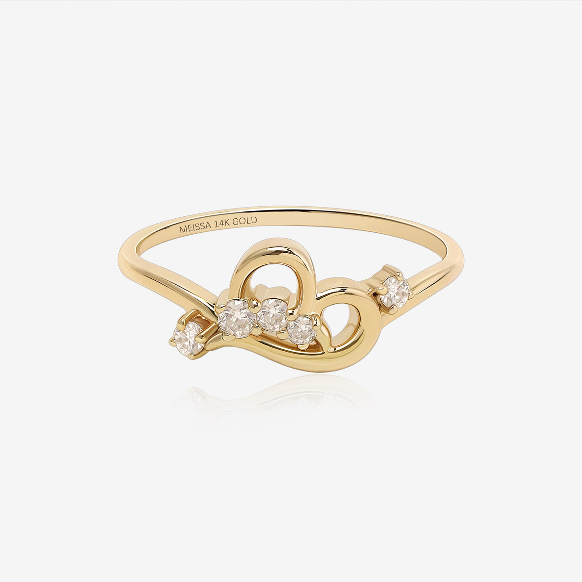 Luminous Heart Ring in solid gold with an open heart design and round moissanite stones.