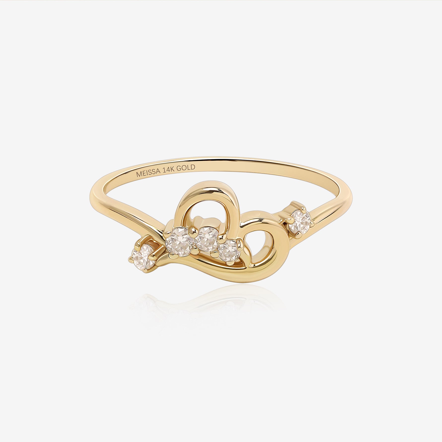 Luminous Heart Ring in solid gold with an open heart design and round moissanite stones.