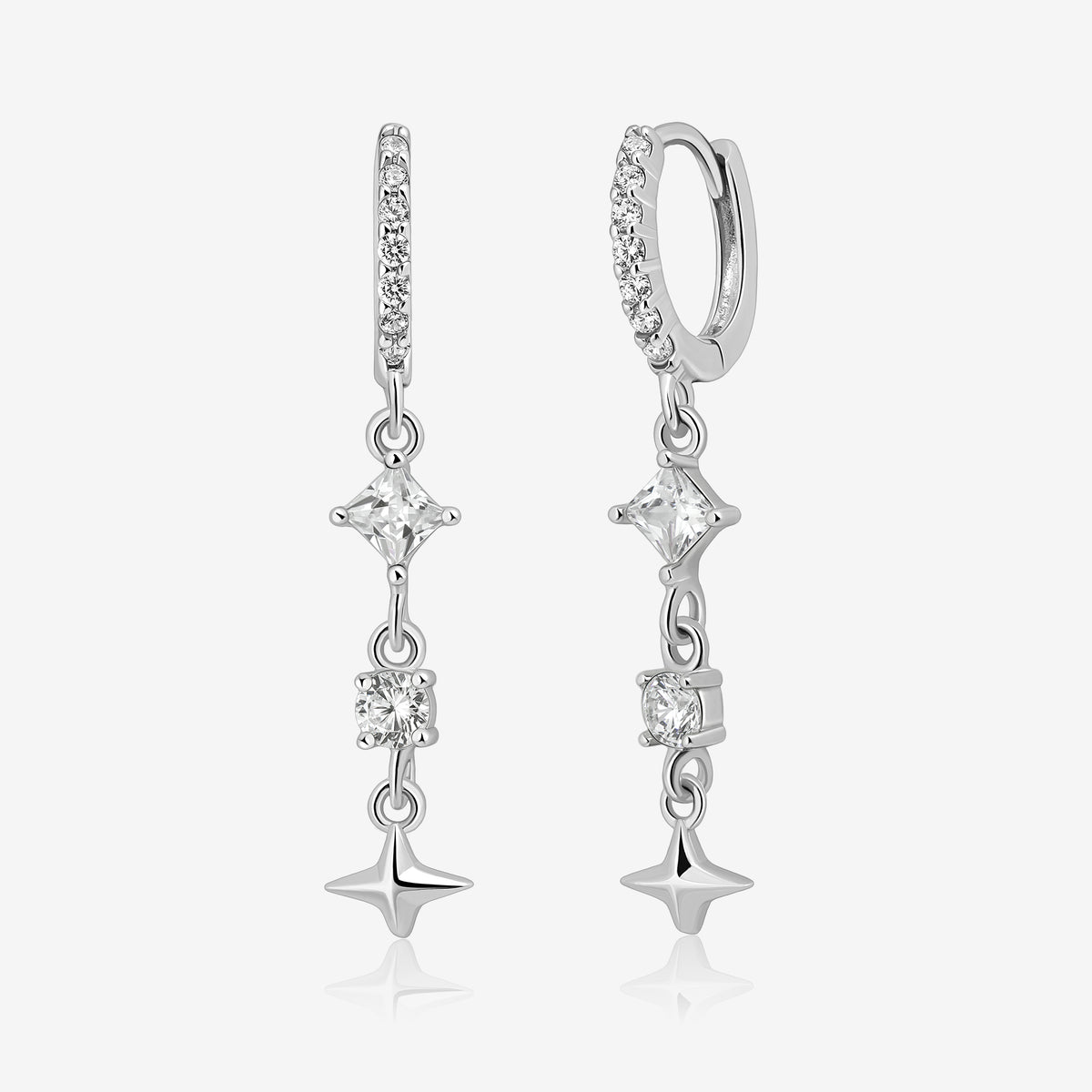 Starlight Drop Huggie Earrings shown as a pair, featuring pavé huggie hoops with dangling square and round sparkling stones and a small star charm.
