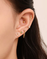 Model wearing Minimalist Touch Earrings Set in 925 sterling silver with layered gold-tone screw back earrings.