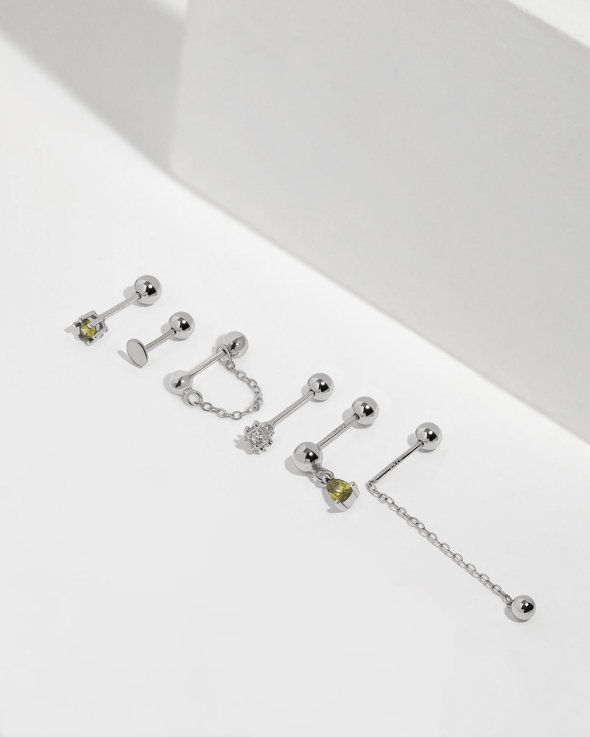 Chain Chic Earrings Set in 925 sterling silver with green stone, cubic zirconia, disc and chain styles with ball backs.