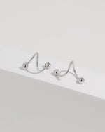 Ball Spiral Screw Back Earrings in silver color displayed from multiple angles on a white surface, highlighting the sculptural spiral construction.