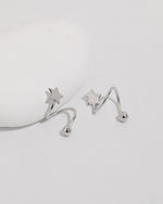 Star Spiral Screw Back Earrings displayed from an angled view with polished star details and round screw backs.