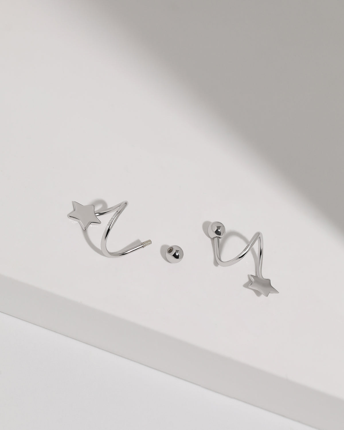 Star Spiral Screw Back Earrings in 925 sterling silver shown with removable screw ball back and threaded spiral post design.