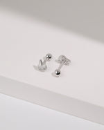 Pair of silver Meissa Bunny Sparkle Screw Back Earrings shown from front and back angles with round screw backs on a white surface.