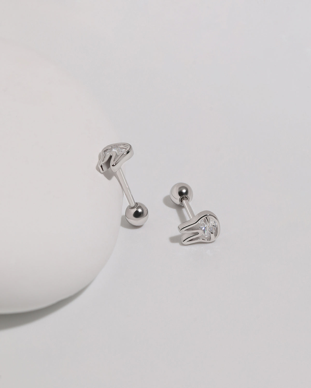 Pair of silver Meissa Bunny Sparkle Screw Back Earrings displayed at different angles to show the bunny design, posts, and round screw backs.