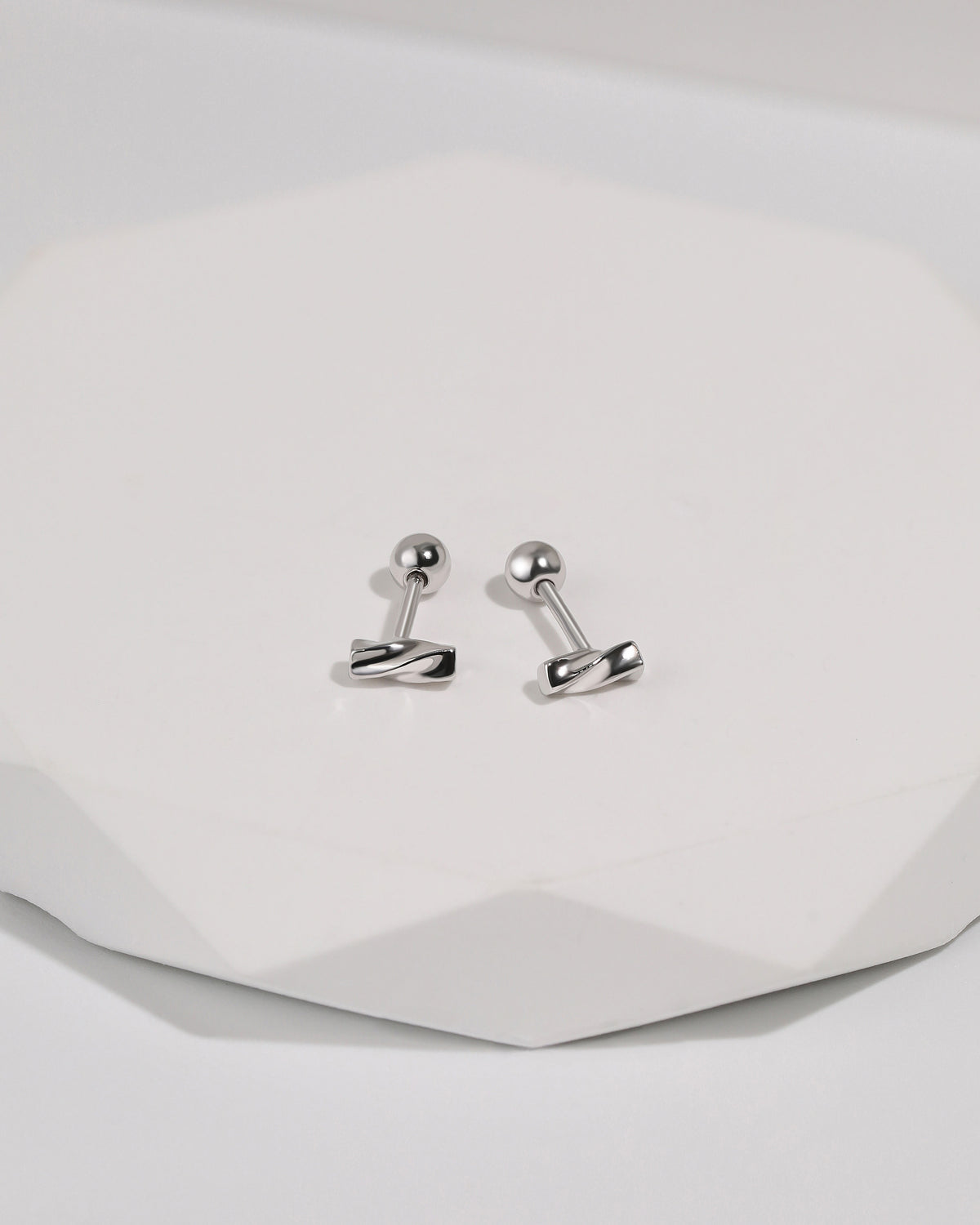 Twist Bar Screw Back Earrings in 925 sterling silver displayed from the back, showing polished twisted bar fronts, straight posts, and round screw back closures.