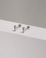 Pair of Twist Bar Screw Back Earrings standing upright, highlighting the polished rectangular twisted bar design and secure screw back style.