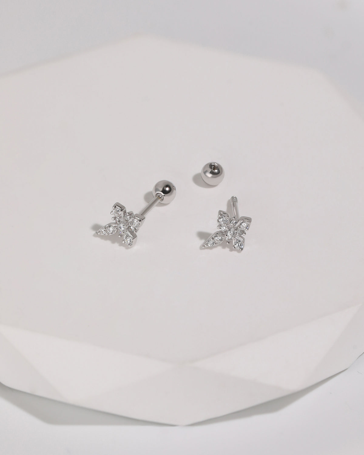 Silver Cross Sparkle Screw Back Earrings with cubic zirconia cross fronts, threaded posts, and a removable round screw back shown separately.