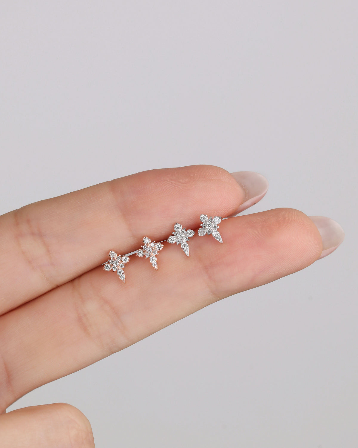 Silver Cross Sparkle Screw Back Earrings shown from front and back angles, highlighting the detailed cubic zirconia setting and screw back construction.