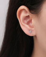 Close-up of a silver Meissa Bunny Sparkle Screw Back Earring worn on the earlobe, highlighting the bunny outline and clear cubic zirconia.