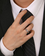 Silver Nova Track Ring in stainless steel styled with a black suit and tie for a modern men's jewelry look.