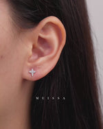 Cross Sparkle Screw Back Earrings in 925 sterling silver featuring sparkling cubic zirconia cross designs, shown worn on the earlobe and in close-up on fingers to highlight the petite size, stone details, and polished finish.